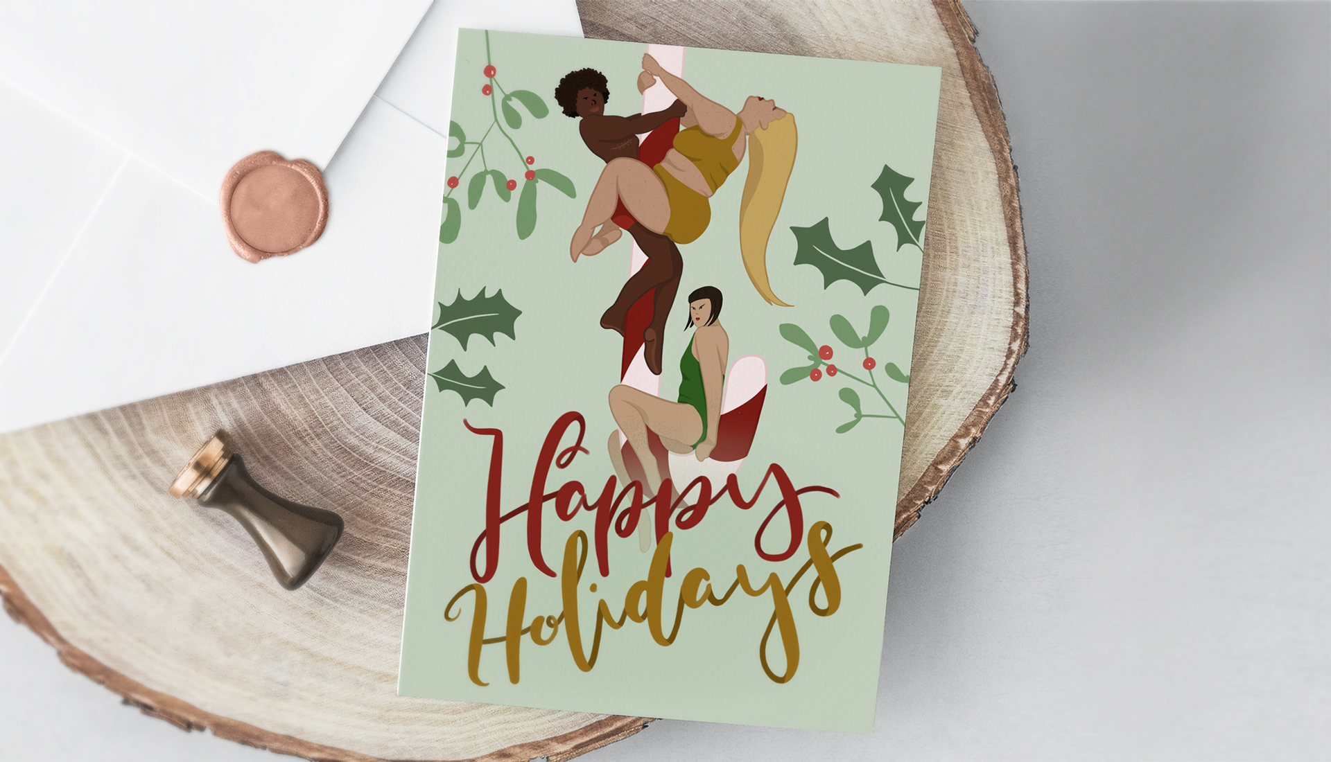 Christmas card with envelope laying on a wooden plate